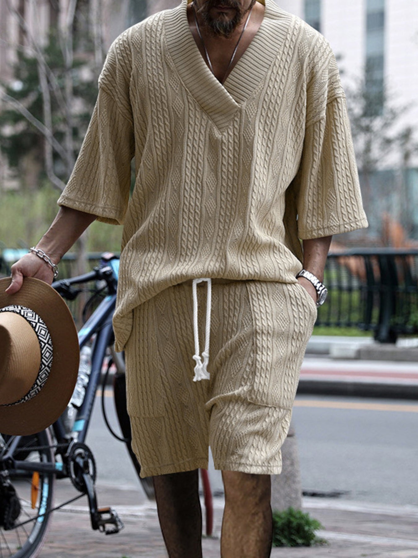 Khaki cable-knit v-neck two-piece set with drawstring shorts and short sleeves.