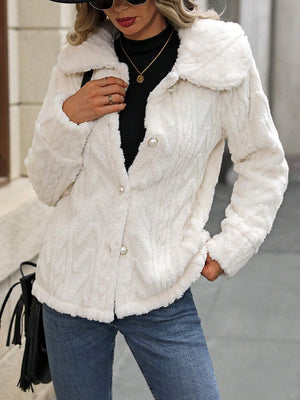 Cream cable knit collar jacket with pearl buttons and textured fabric.