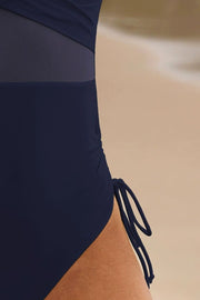 Dark navy one-piece swimsuit with mesh panels and adjustable side ties.