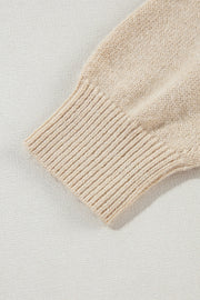 Tan knit sweater sleeve with ribbed cuff detail, acrylic fabric.