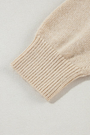 Tan knit sweater sleeve with ribbed cuff detail, acrylic fabric.