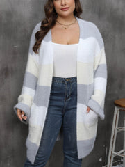 Chunky stripe open-front cocoon cardigan in grey, white, and cream acrylic with pockets.