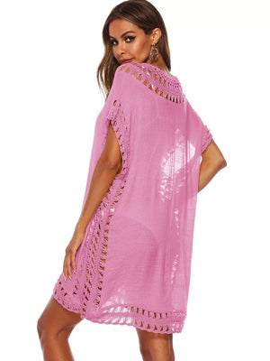 Pink crochet V-neck cover-up dress with cutout details and short sleeves.
