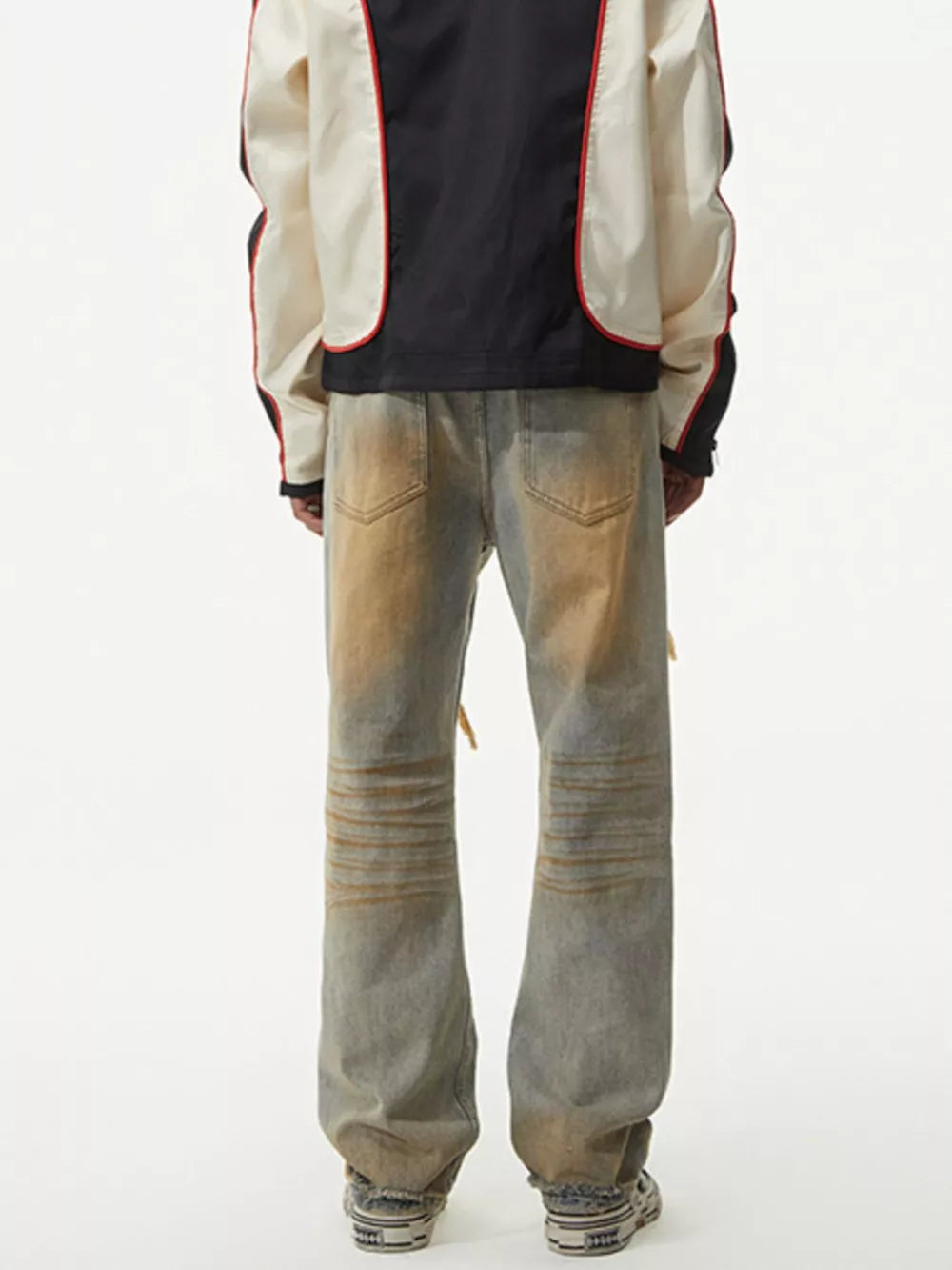 Men's distressed jeans with unique wash and ribbed knee detail.