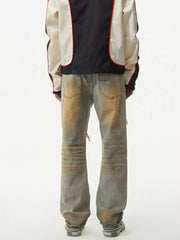 Men's distressed jeans with unique wash and ribbed knee detail.