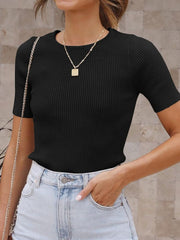 Black ribbed knit t-shirt with short sleeves and a crew neck, styled with light wash jeans.