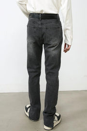 Split-hem washed denim trousers in dark, with a straight leg and back pockets.