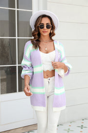 Open knit cocoon cardigan with rainbow stripes in lavender, mint green, and white acrylic.