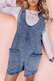 Acid wash denim romper with patch pockets and a U-neckline.