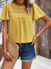 Dotted Swiss smocked bodice flutter sleeve top in chartreuse with lace trim detail.