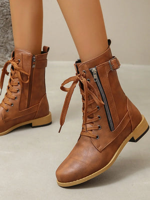 Caramel combat boots with lace-up front and side zipper detail.
