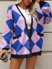 Argyle knit oversized cardigan in pink purple and blue with navy trim and pockets.