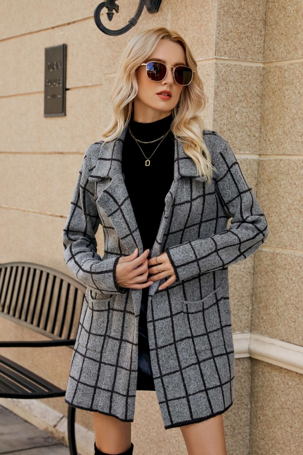 Gray grid-print knit blazer coat with open front and pockets.