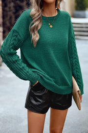 Dark green acrylic sweater with cable-knit sleeves and crewneck.
