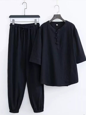 Black Chinese-inspired men's relaxed fit pants set with drawstring waist and button-up top.
