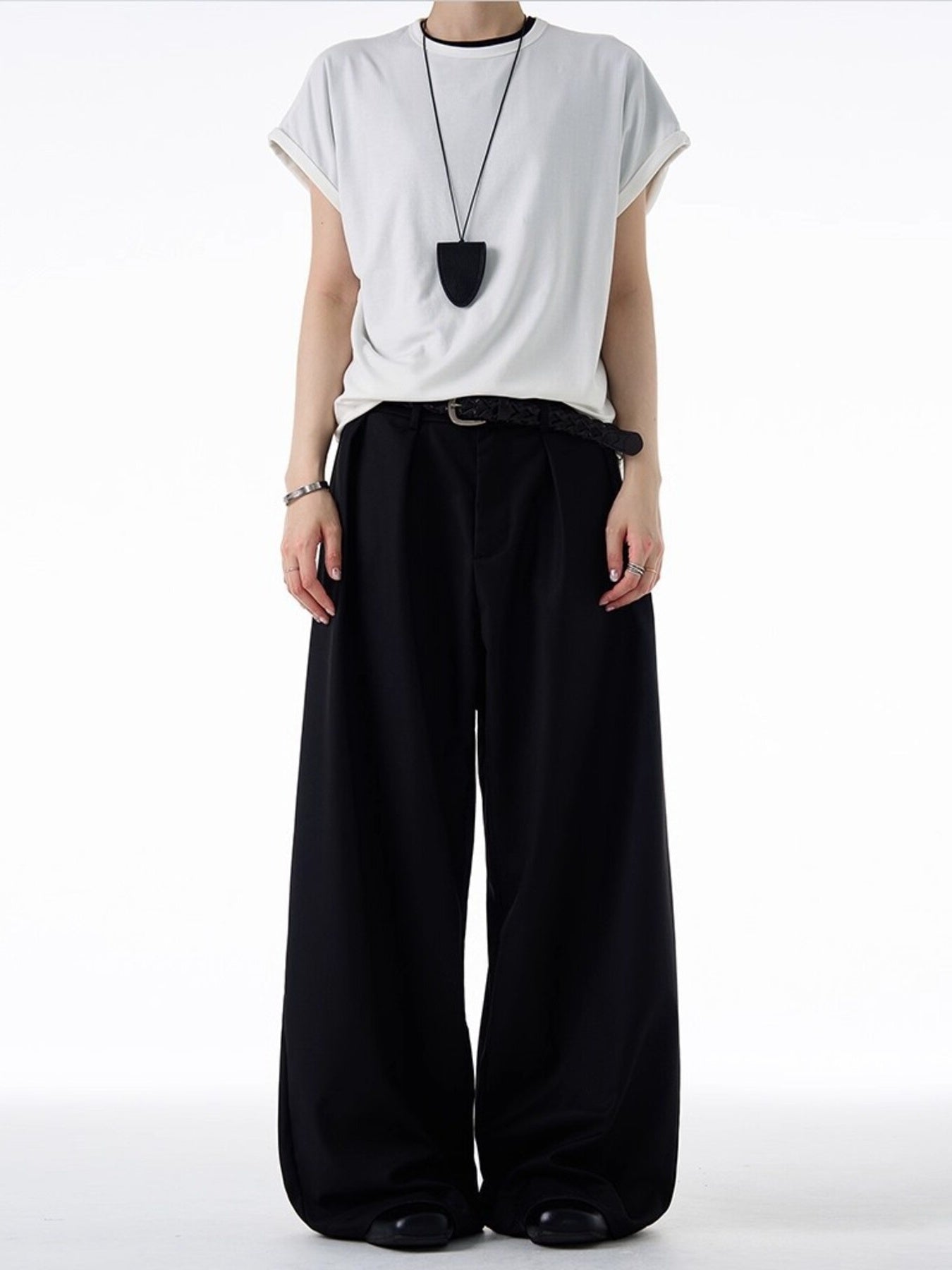 Black relaxed fit sweatpants with elastic waistband and wide leg
