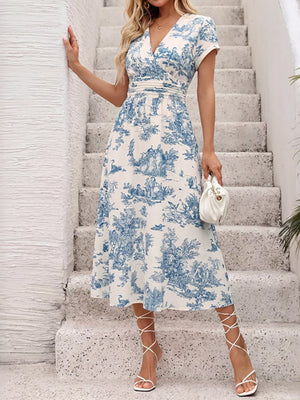 Blue and white toile print midi dress with V-neck, short sleeves, and A-line skirt.