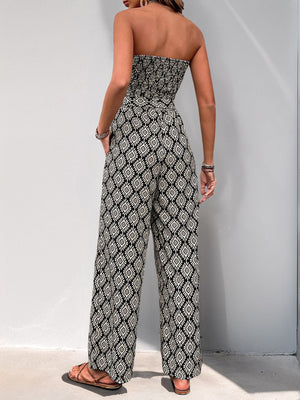 Geometric print bandeau jumpsuit in black with wide legs and a belt.