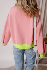 Blush pink sweatshirt with neon trim on cuffs and hem.