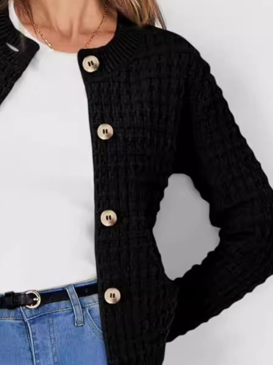 Black textured knit button-up cardigan with gold buttons.