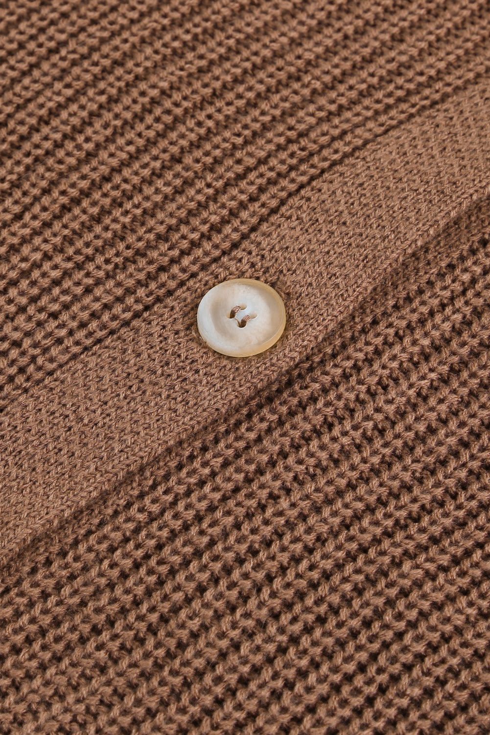 Taupe knit cardigan with a single button closure and diamond-cut detail.