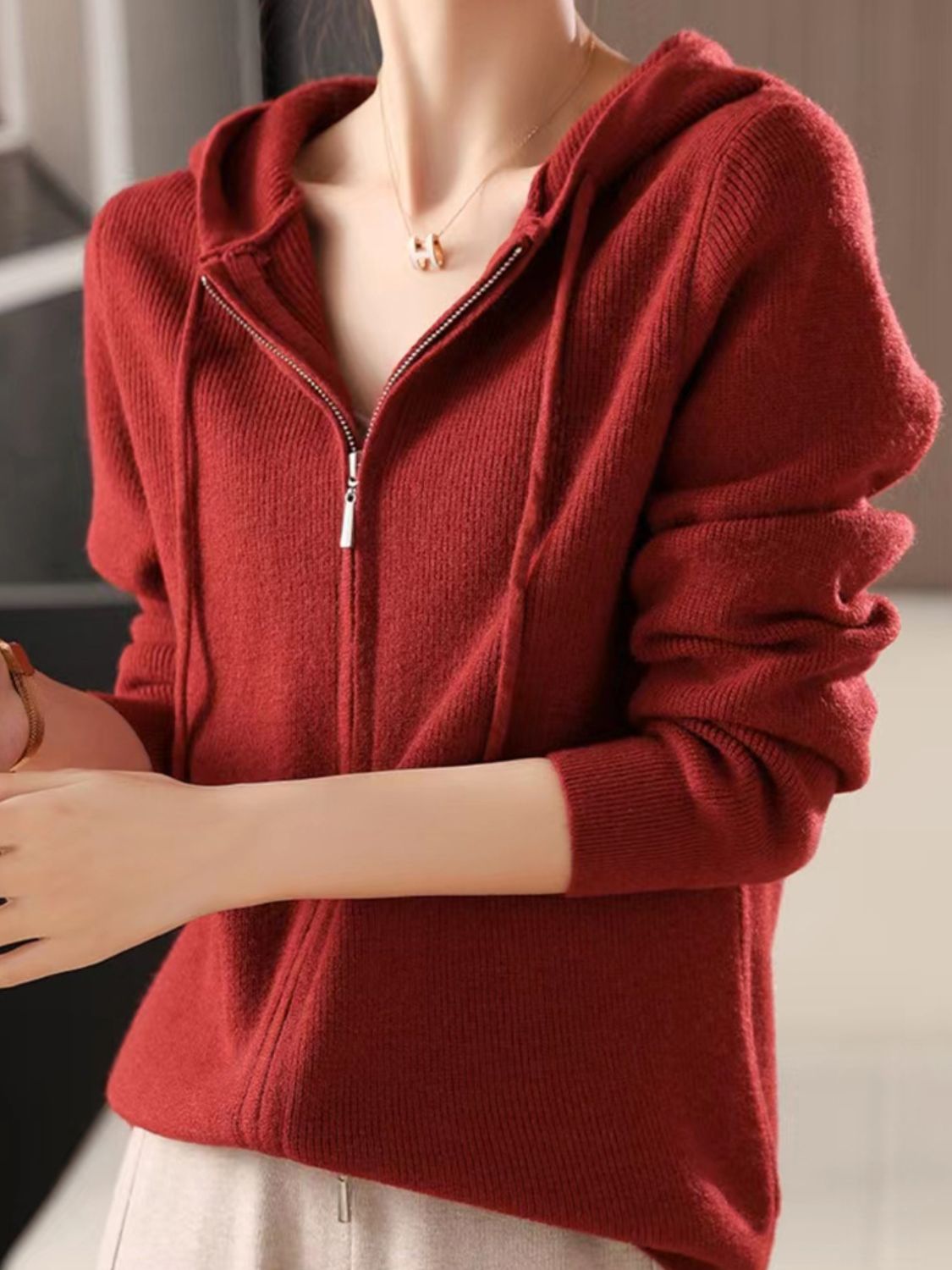 Ribbed knit zip-through hoodie in Scarlet with drawstring hood and silver zipper.