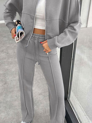Gray bomber jacket and wide-leg tracksuit with drawstring waist and zippered ankles.