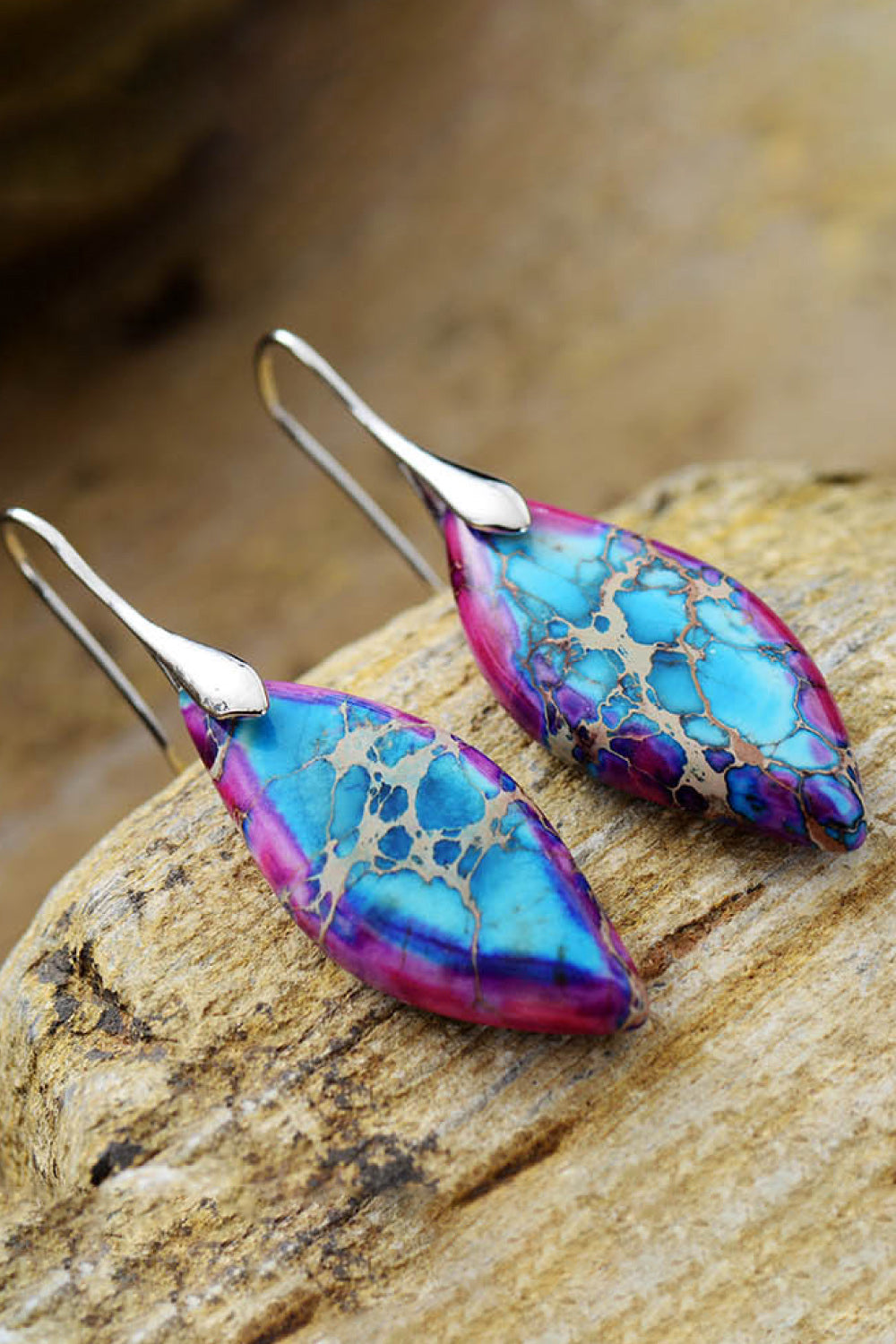 Gemstone kaleidoscope dangle earrings in multicolor with 14K gold-plated hooks.