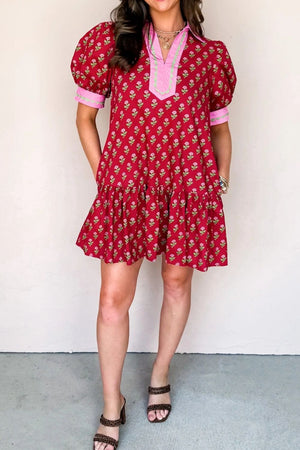 Red floral mini dress with puff sleeves, V-neck, and tiered hem