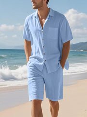 Men's light blue short sleeve button-up shirt and shorts set with a chest pocket.