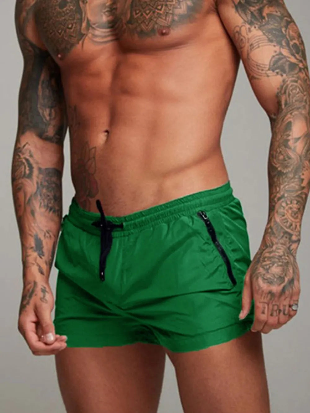 Green boardshorts with drawstring and zip pockets