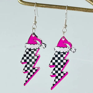 Festive acrylic lightning bolt earrings with pink Santa hats and checkerboard pattern