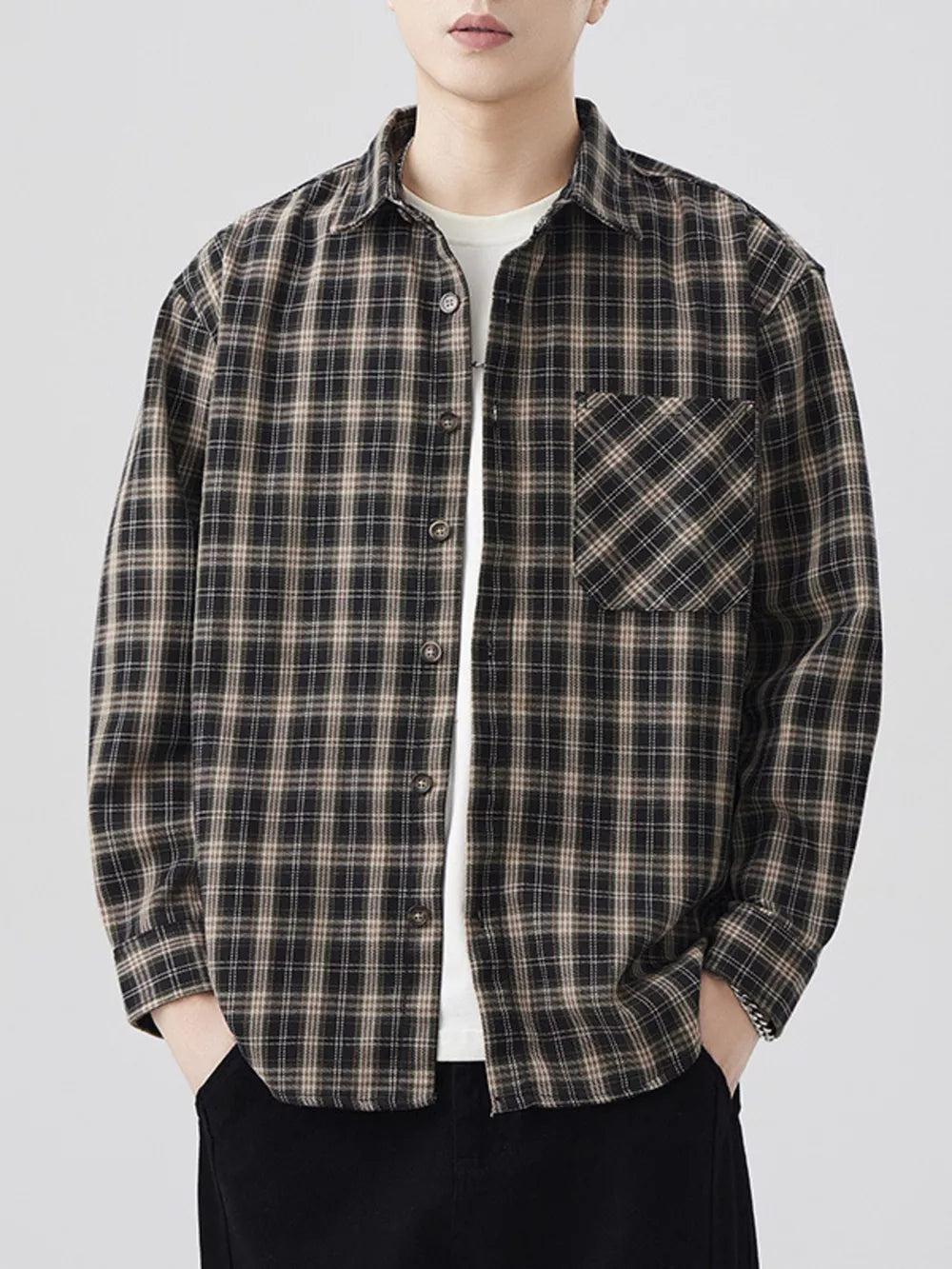 Men's brown and black plaid long sleeve button-down shirt with chest pocket.