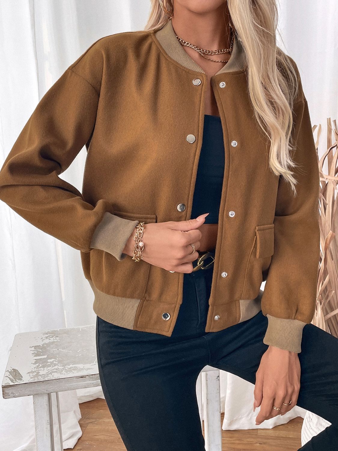 Caramel felted wool-blend bomber jacket with button front and ribbed cuffs.
