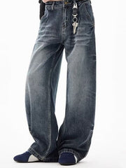 Men's blue denim wide-leg jeans with belt loops and button closure.
