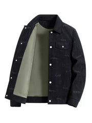Black corduroy jacket with all-over smiley face and word print, button front, and chest pocket.