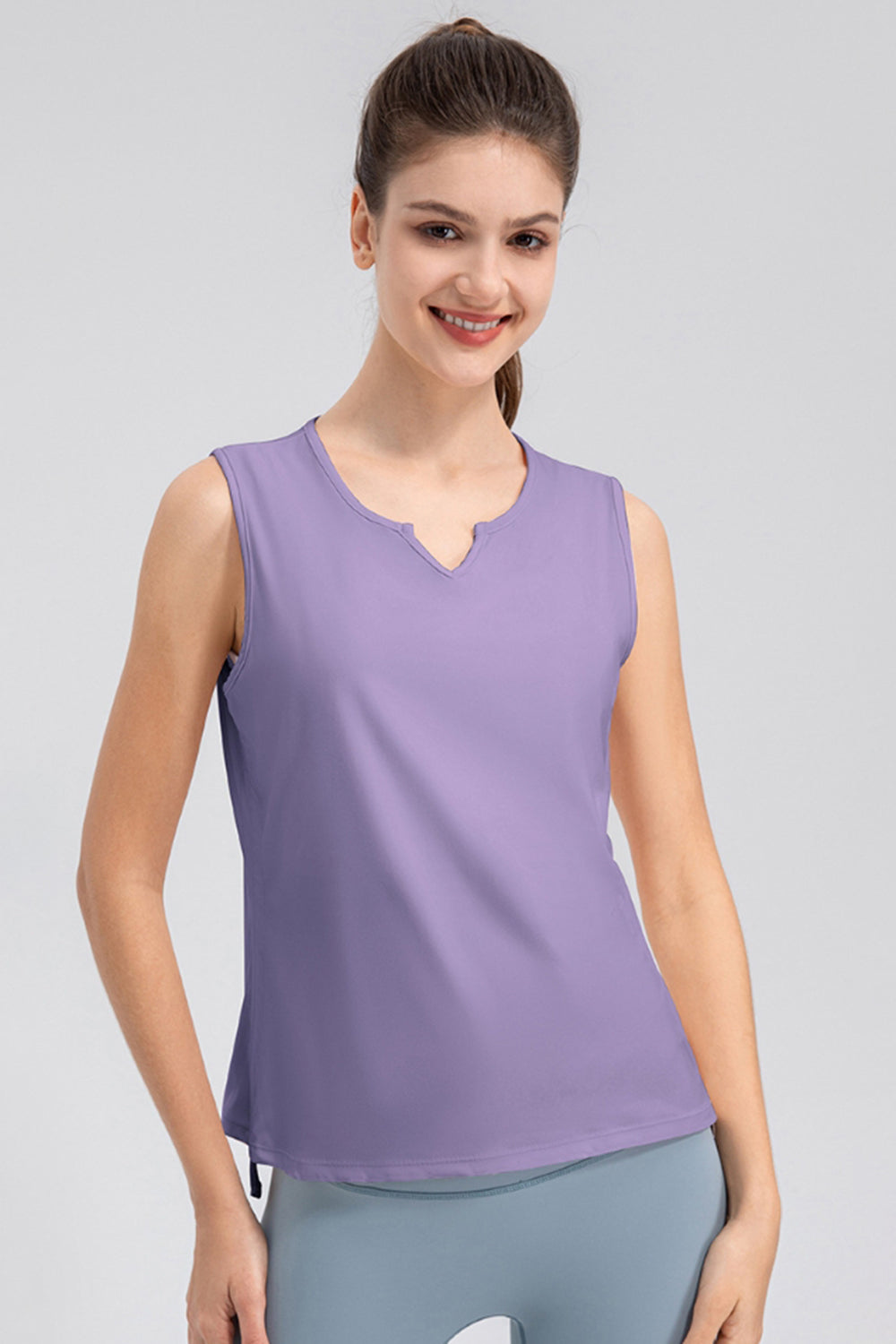 Lavender active tank top with notched neckline and sleeveless design