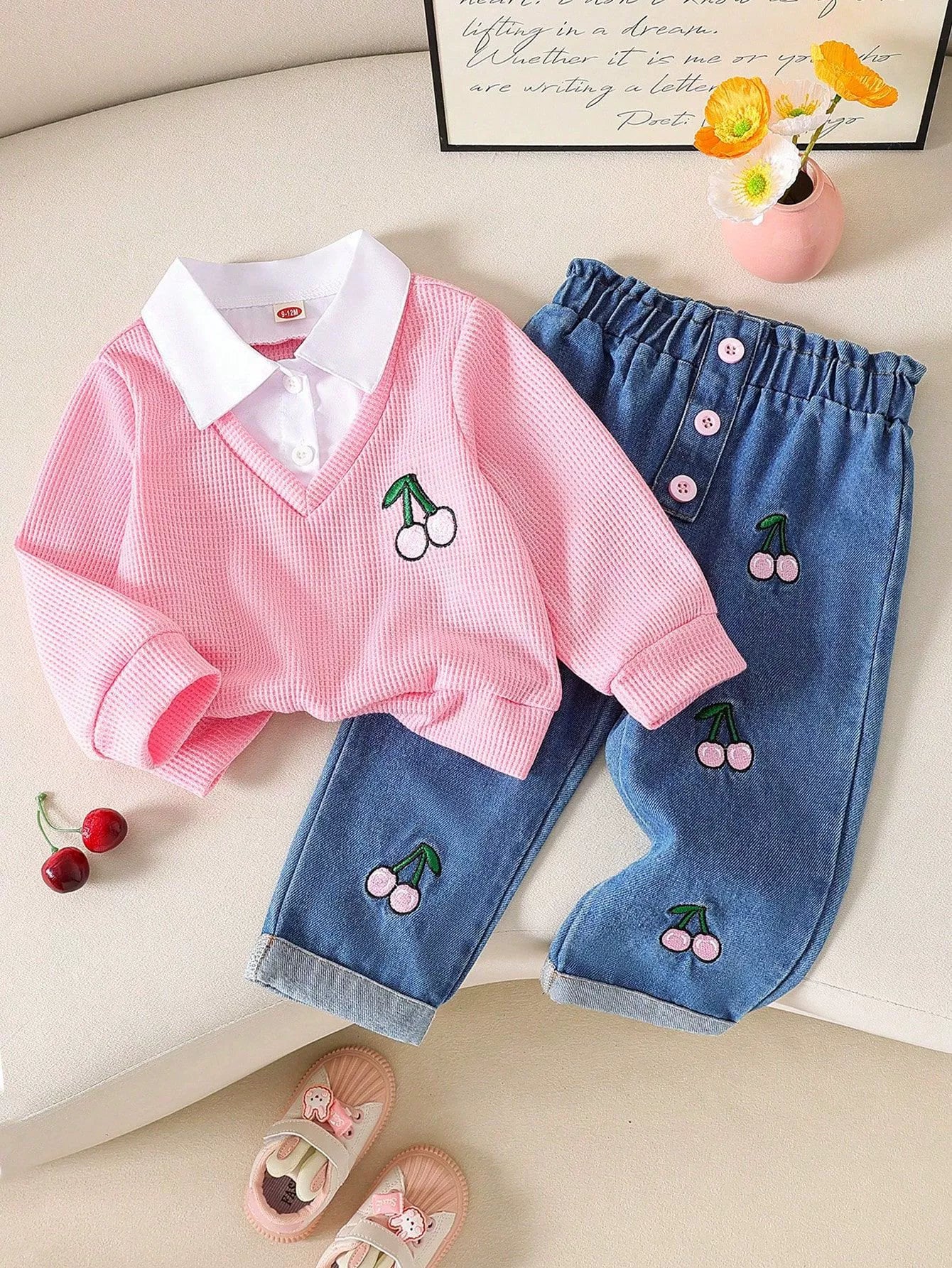 Pink baby set with cherry embroidery, white collared shirt, and denim jeans.