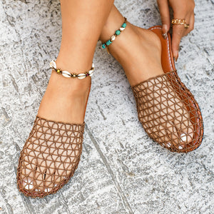 Breathable woven mule sandals in dark brown with a net-like texture.