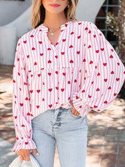Maternity blouse with pink stripes and red hearts, button front, flounce sleeves.