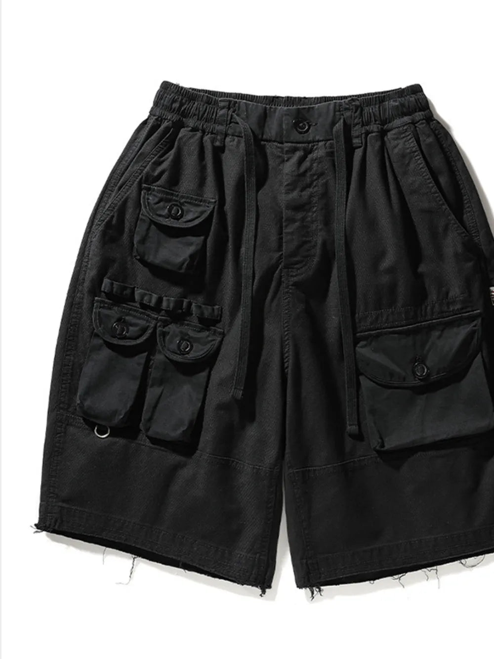Black cargo shorts with multiple utility pockets and drawstring waist.