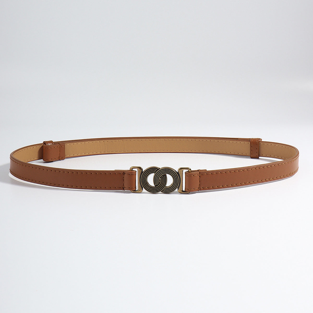 Brown vegan leather belt with interlocking bronze buckle detail