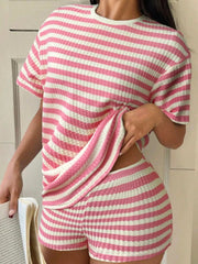 Pink and white striped waffle knit loungewear set with crew neck top and shorts.