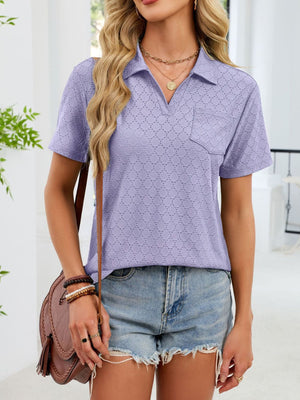 Lavender eyelet polo blouse with short sleeves and a chest pocket.