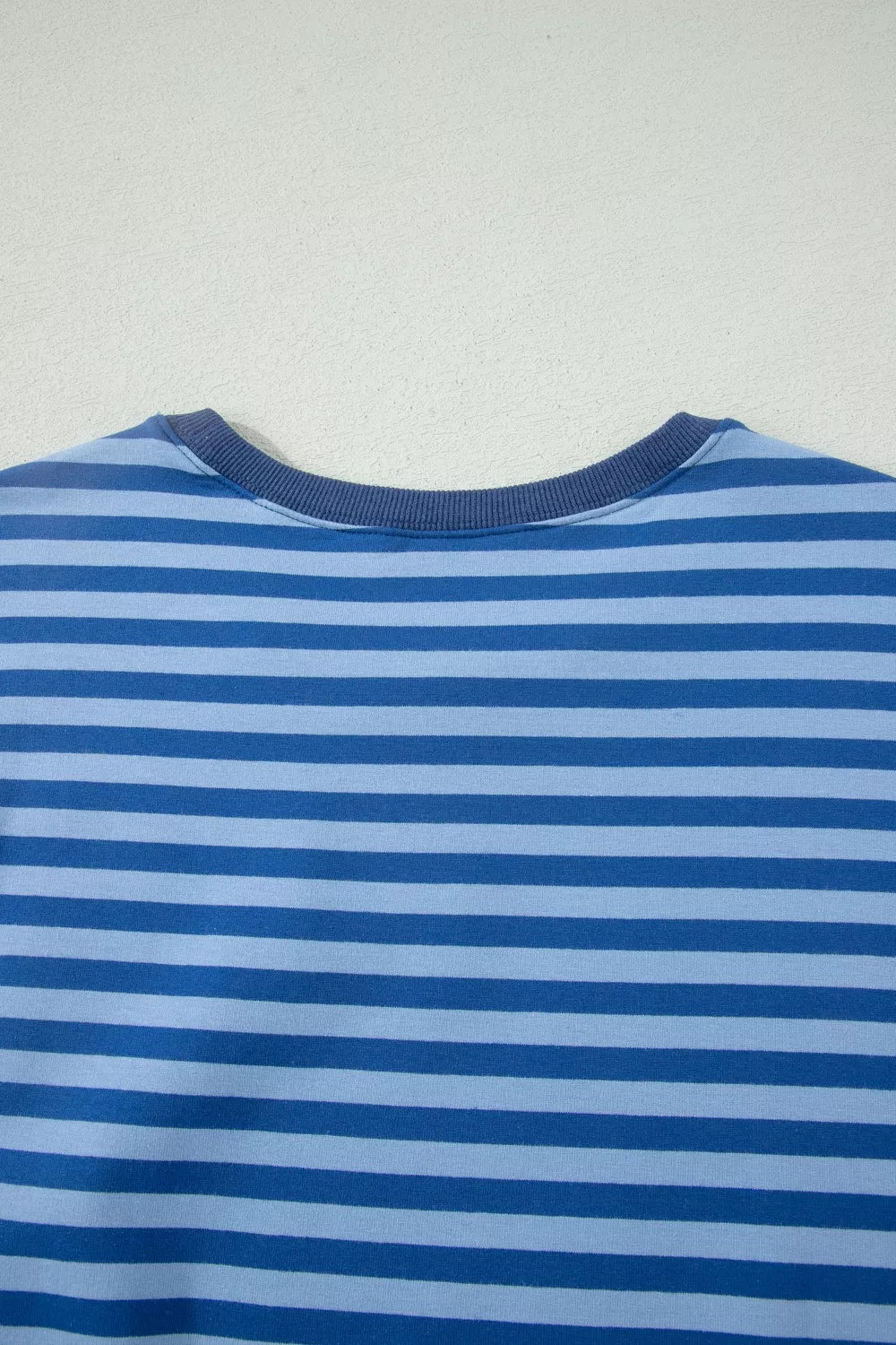 Blue striped cotton crew neck top with ribbed neckline.
