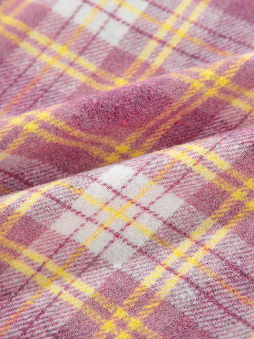 Oversized shacket with pink, yellow, and white plaid pattern.