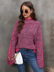 Colorblock raglan sleeve turtleneck knit sweater in cerise acrylic with contrasting sleeves.