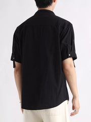 Black cotton button-down shirt with rolled-up short sleeves and a mandarin collar.