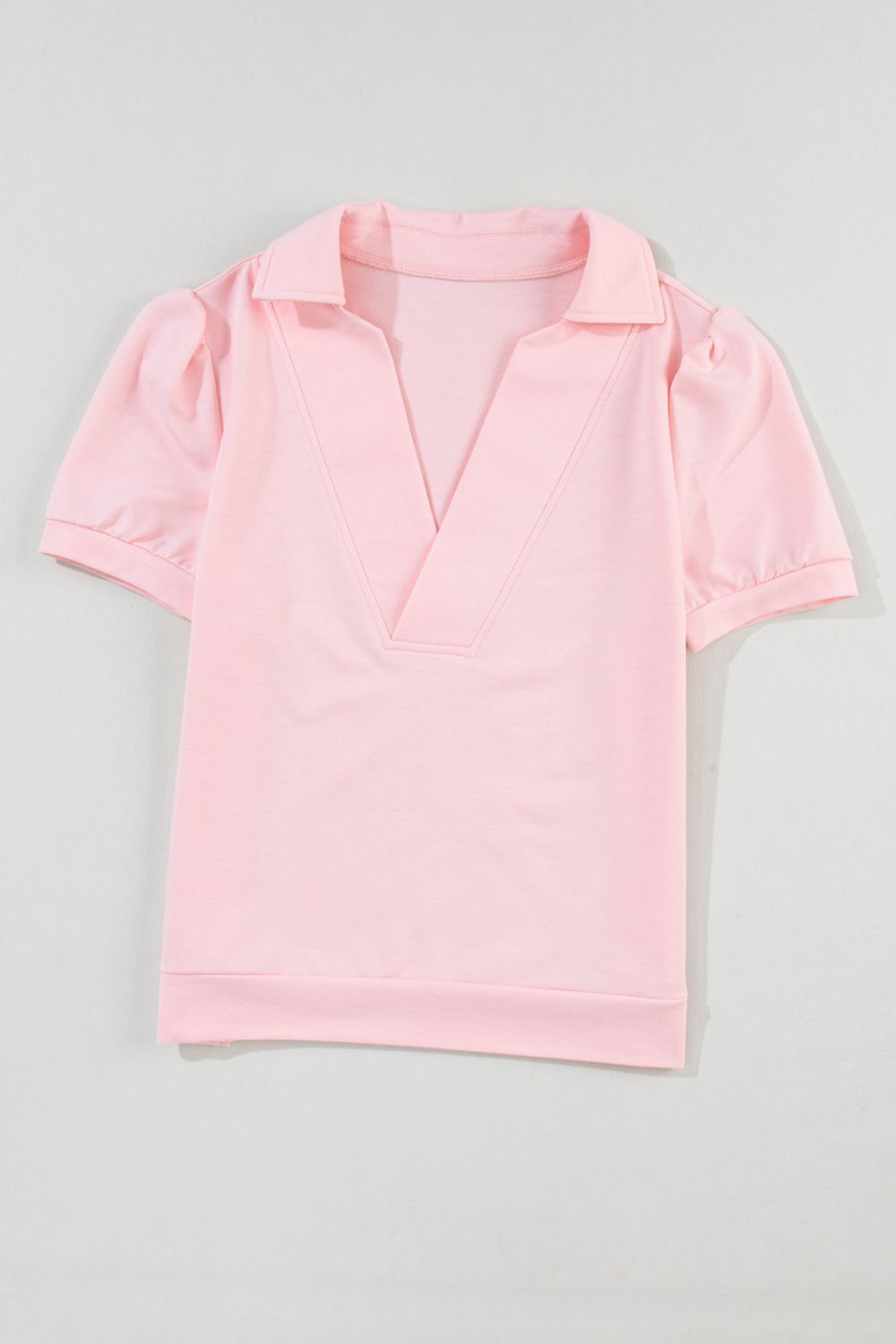 Blush pink V-neck collar tee with short puff sleeves and a relaxed fit.