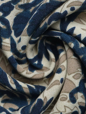 Ornate cap sleeve blouse with notch neckline in a blue and tan floral print fabric.